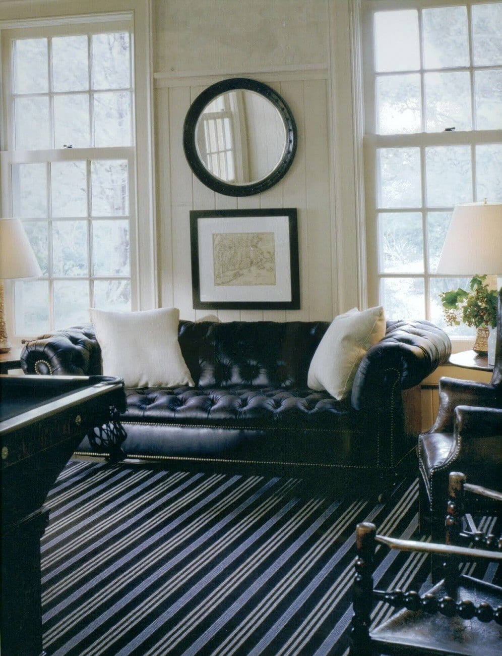 Victoria Hagan - black leather sofa - decorating to impress women