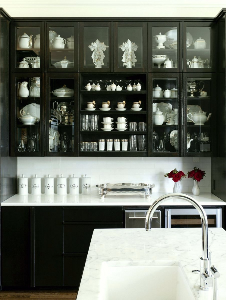 at home arkansas kitchen black cabinets glass doors marble counter - handsome black and white interiors