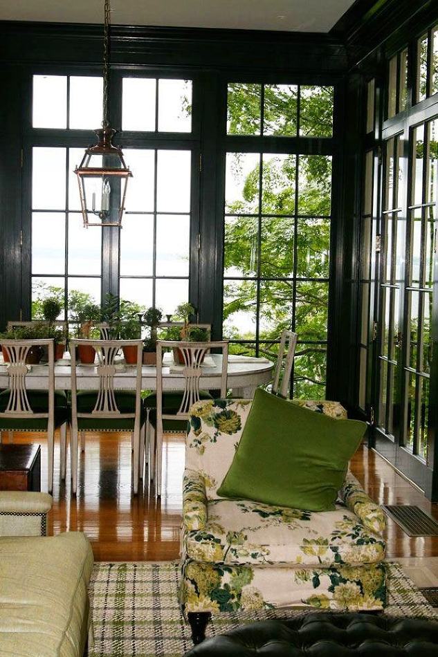 Windsor Smith dark green and white sunroom dining area