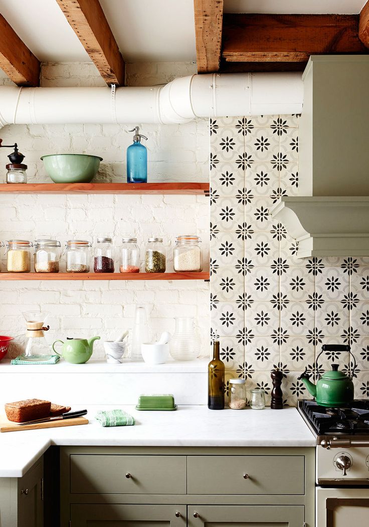 A+Row+House+Reinvented-lonny-kitchen backsplash-tile-idea - with painted exposed brick, open shelves and rustic beams