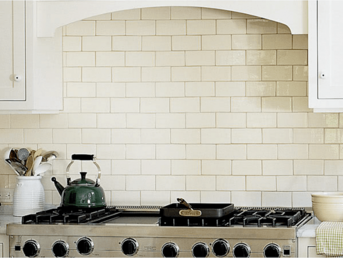 walker-zanger-handmade-white-subway-tile over the range in a white kitchen