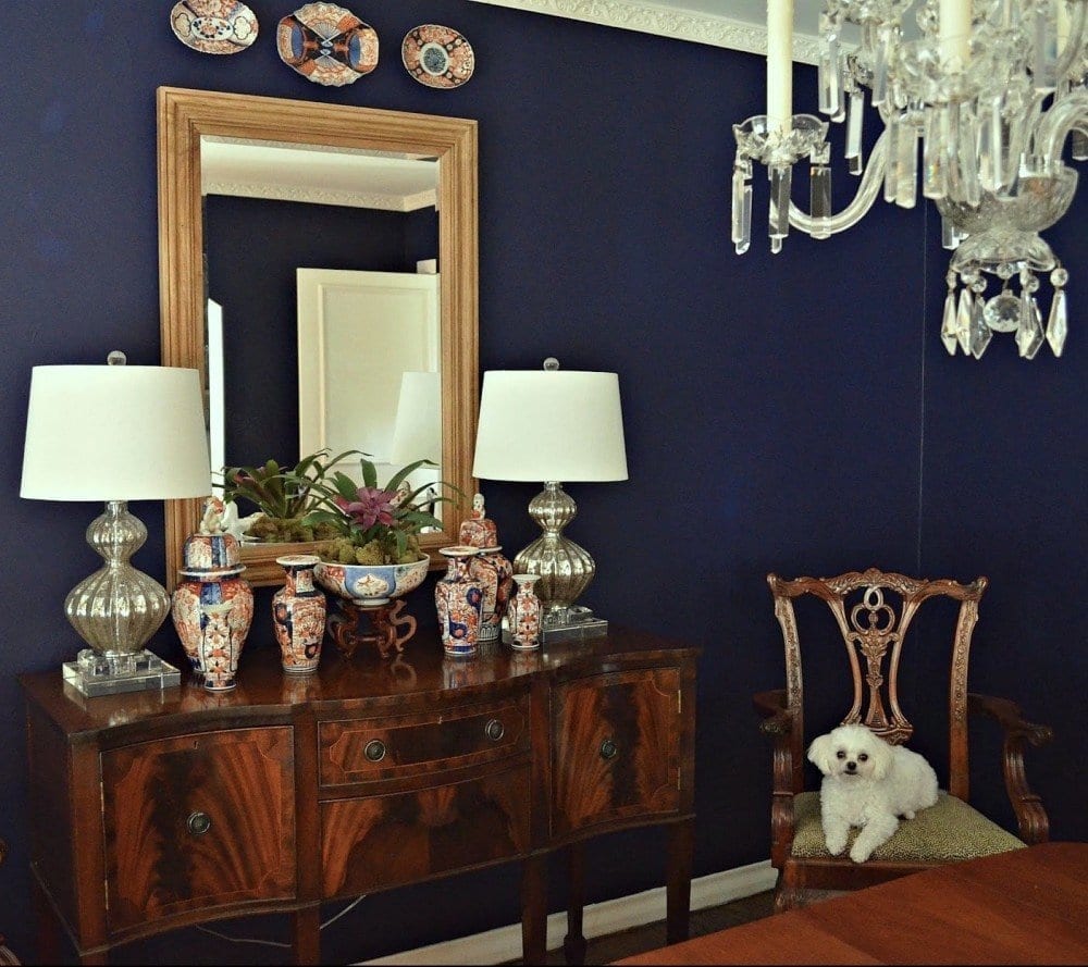 lovely dining room furniture - mahogany looks great against the navy walls