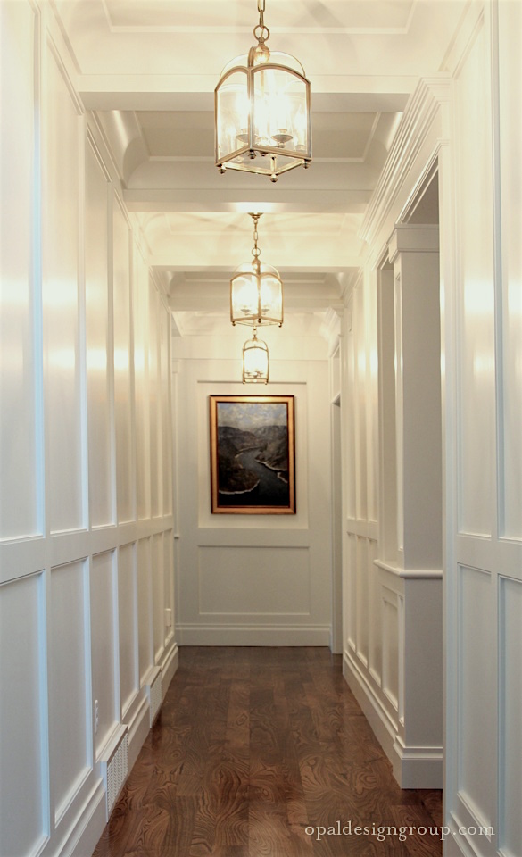 opal-design-group-wainscoting-hall-coffered-ceiling-brass-pendant-lanterns-white-gloss-paint