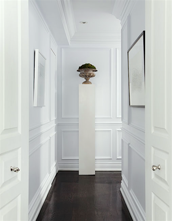 white-painted walls with mouldings