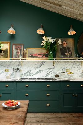 devol kitchens forest green cabinets marble and a shelf with art