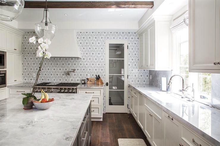 white-marble-countertops-gray-flower-mosaic-tile-backsplash