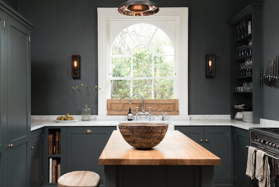deVOL-WilmingtonSquare- I ADORE this smexy kitchen which is both modern and old at the same time. Kitchen Backsplash is only over the range. Only a small 3" lip of the same material that's on the counter.