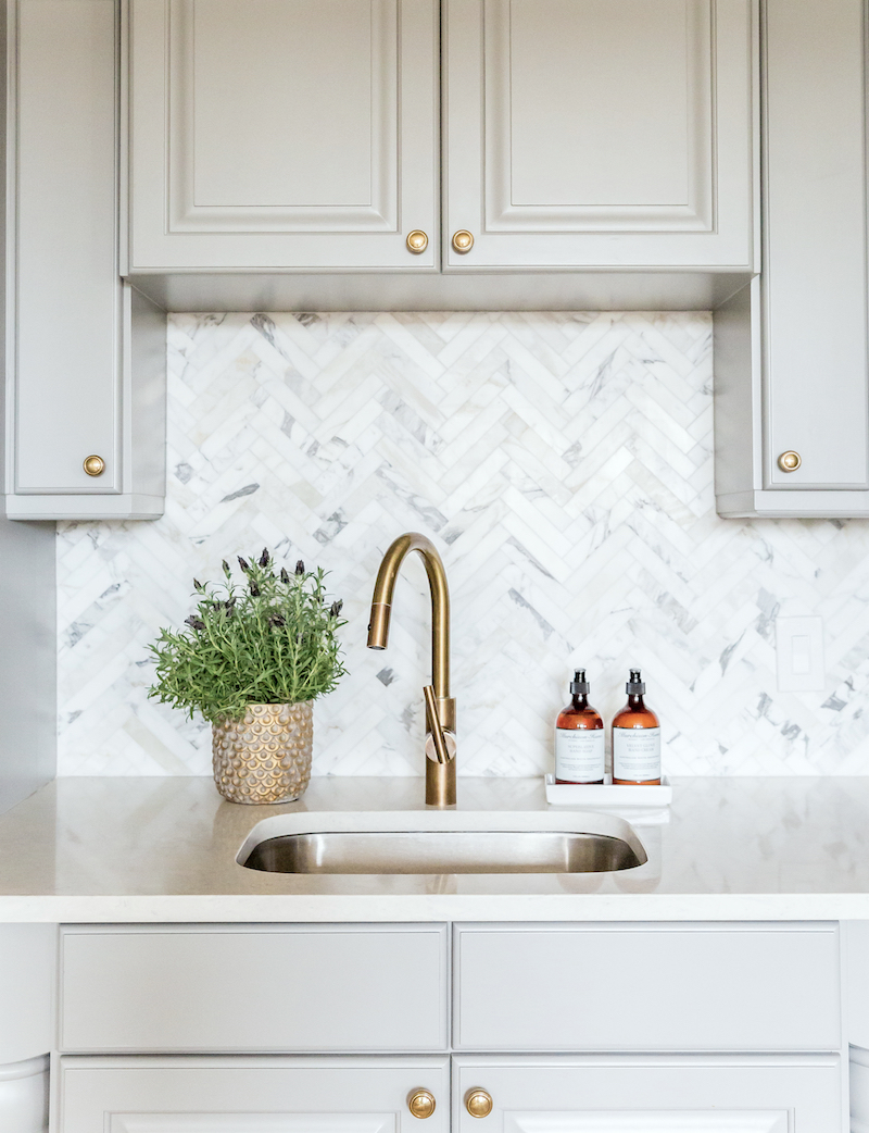 Benjamin+Moore+Chelsea+Gray+Cabinets+and+Marble+Herringbone+Kitchen Backsplash+||+Studio+McGee Photo by Lindsay Salazar