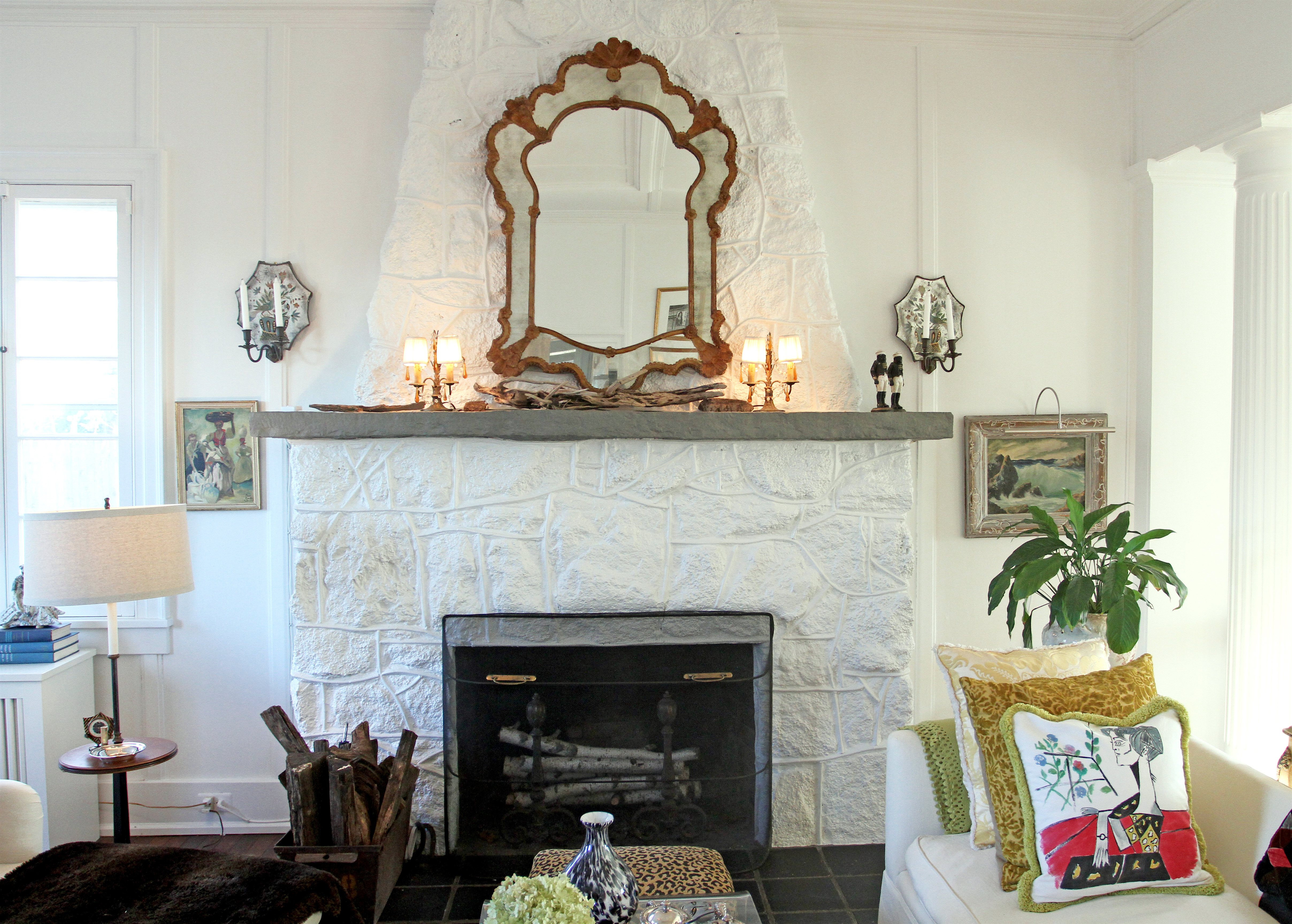 Nancy Keyes' formerly brown stone fireplace, now painted a pristine white