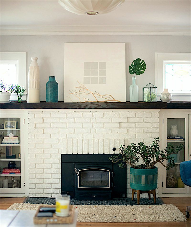 beautiful white painted brick fireplace