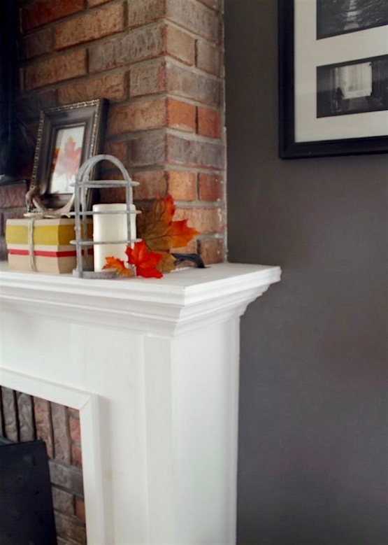 ugly brick fireplace with a lovely wood mantel