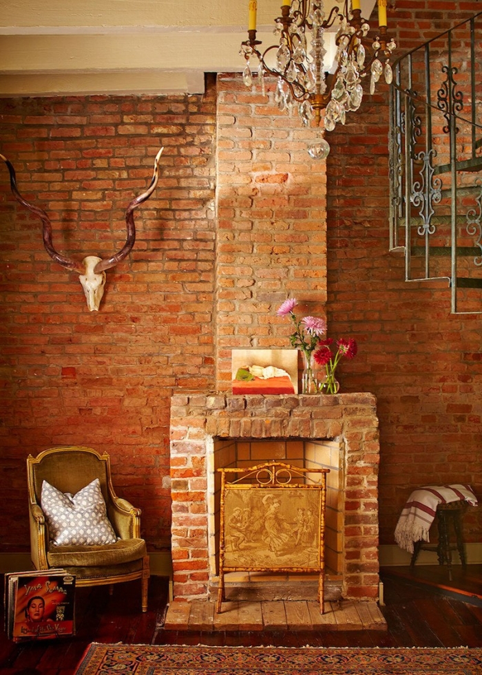 rustic exposed brick fireplace mantel and wall | Logan Killan Design