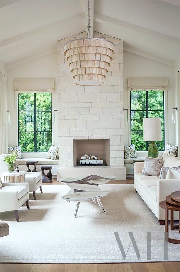 lovely white painted stone fireplace disappears creating a white-on-white textured contemporary space