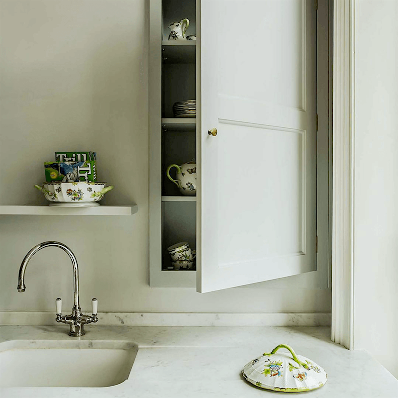 plain english kitchen recessed cupboard in a pale celadon kitchen