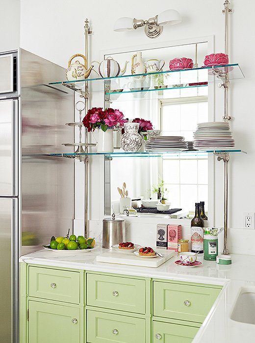 one_kings_lane_la_duree_kitchen_counter_and_shelves - Designed by Shalini - green cabinets - mirror behind glass shelves