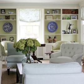 McCarthy Bronxville living room pale colors - seagrass rug - hydrangeas - blue transferware plates - Roman shades