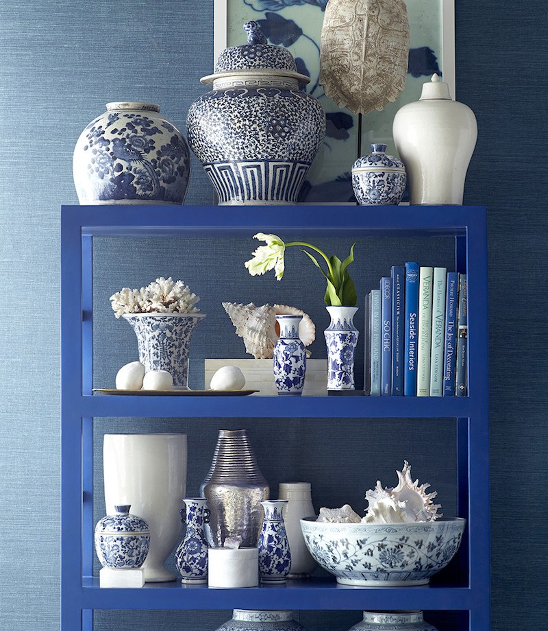 beautifully styled bookcase with blue and white chinoiserie porcelains from wisteria - Affordable Home Decor Ideas