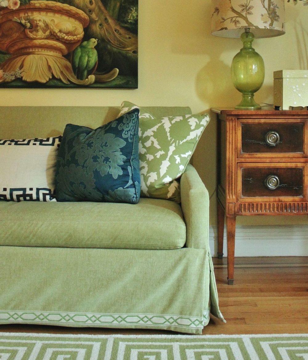 A vignette from my living room with a Lee Industries sofa. Wall color Benjamin Moore Hawthorne Yellow