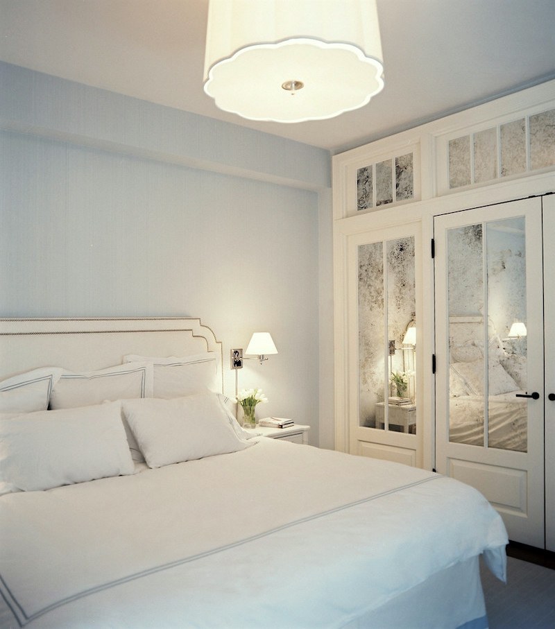 windowless room - mirrored closets in a pretty bedroom