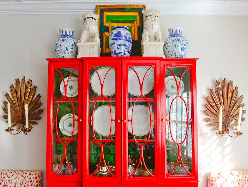 decorating above cabinets - Katie Luepke with a red lacquer china cabinet and Chinoiserie porcelains on top.