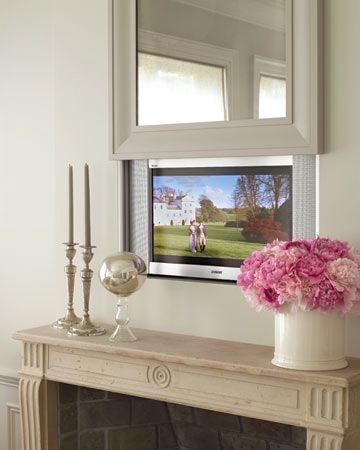 living room TV via Martha Stewart - so clever hidden behind the mirror