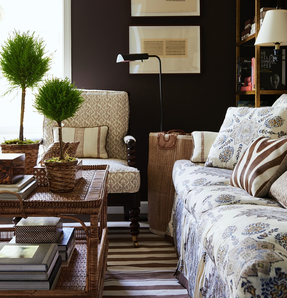 Mark D Sikes, handsome den with black or navy walls and persepolis fabric on sofa