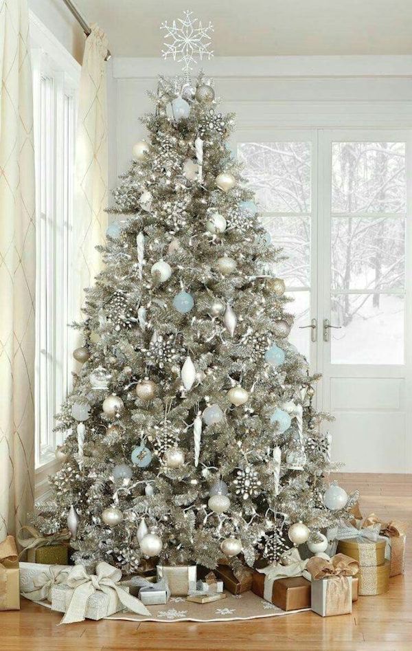 white christmas tree with blue and silver decorations