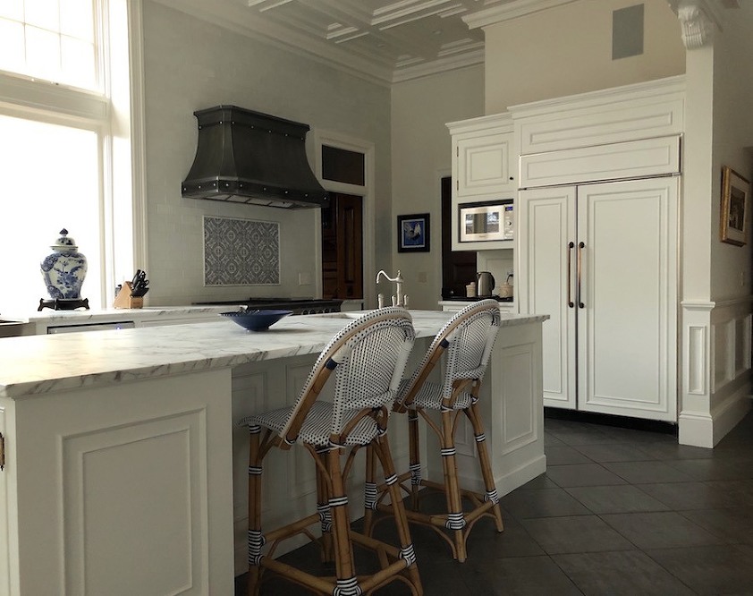Greek Revival kitchen revived with white cabinetry and architectural details