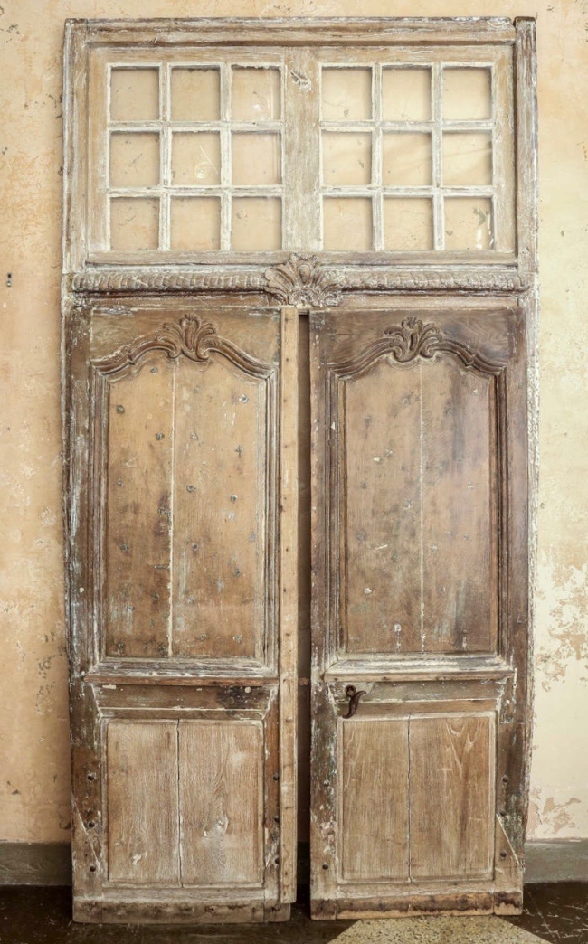 pair of 18th century provencal doors with oridina transom window via first dibs