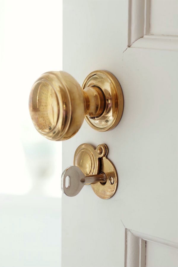 Fabulous new-trad interior design by Sarah Richardson. Love the unlacquered brass door knobs - Photography by Stacey Brandford