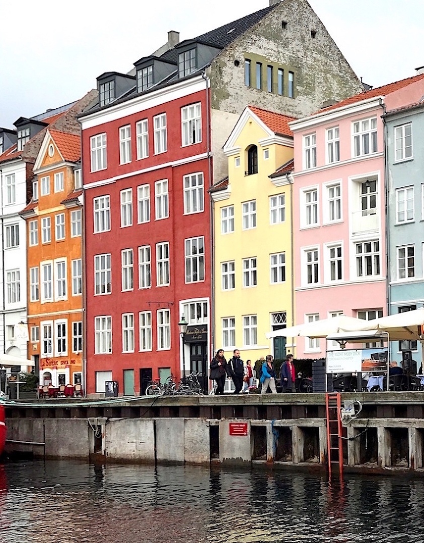 Nyhavn - waterfront - colorful houses - boat tour seeking hygge in copenhagen- no railing - no wall