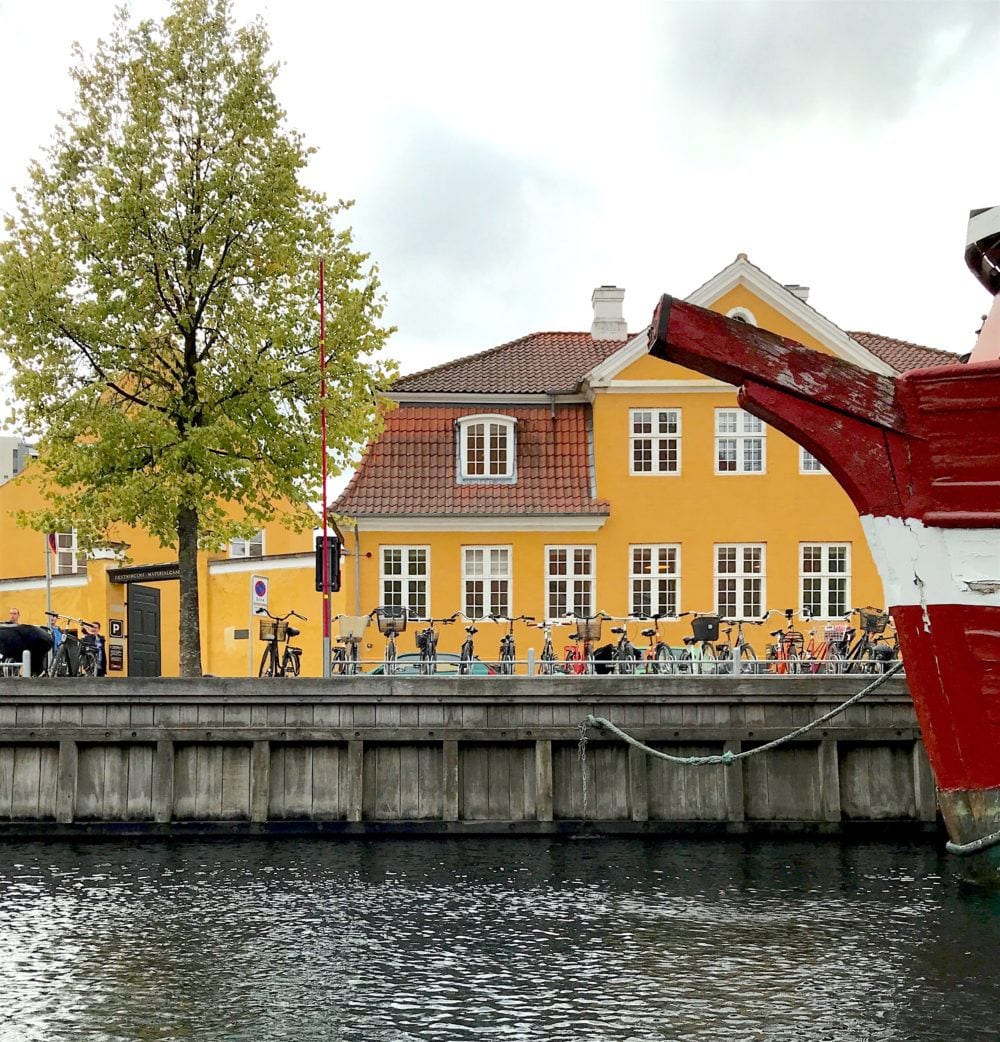 Nyhavn - waterfront -yellow house-boat tour seeking hygge in copenhagen