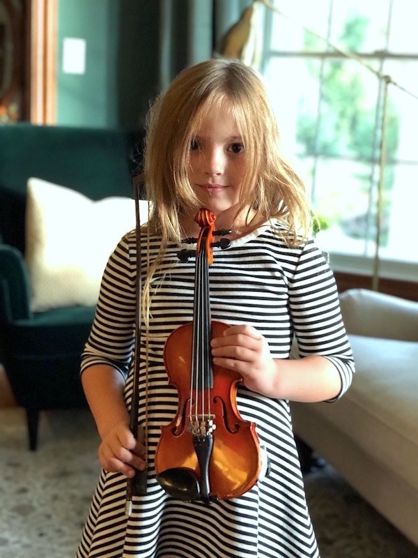 Laura's daughter with baby violin