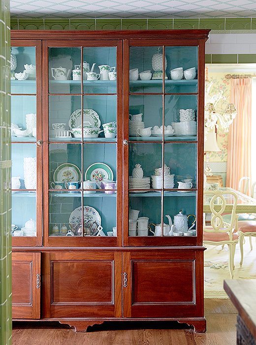 via One Kings Lane Madcap Home Tour_Turquoise interior mahogany china cabinet - Granny chic decor - brown furniture - great color balance
