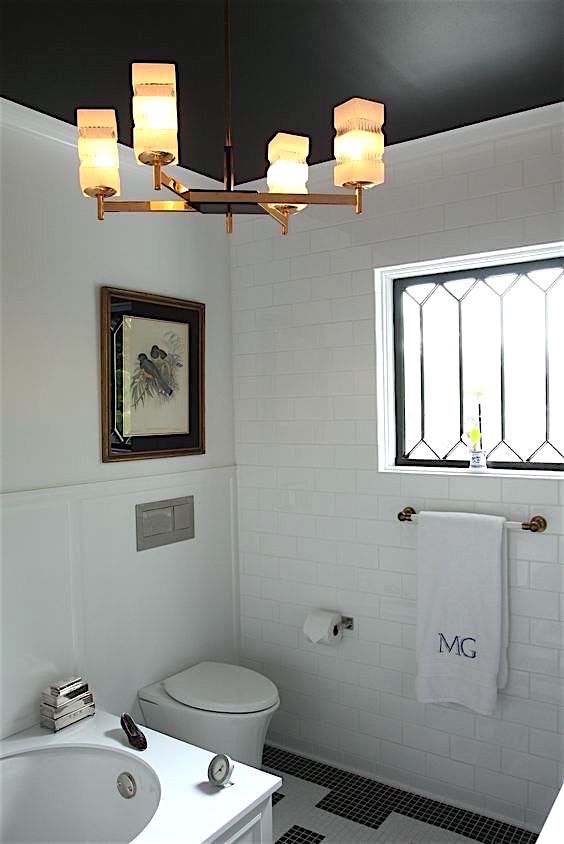 Nancy Keyes - black ceiling bathroom after brass chandelier - Benjamin Moore Racoon Fur black ceiling