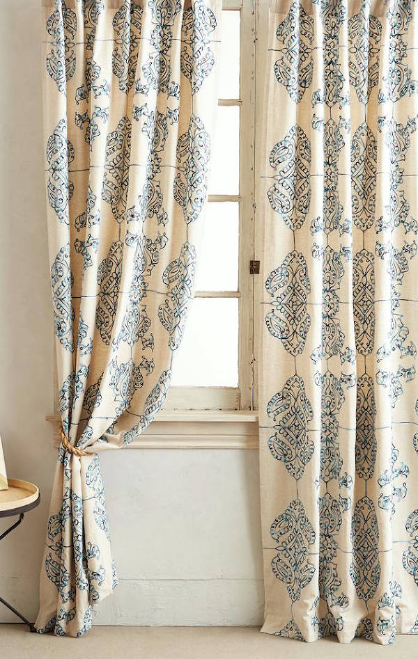 Anthropologie curtains are an inexpensive alternative to custom draperies - help for a boring room