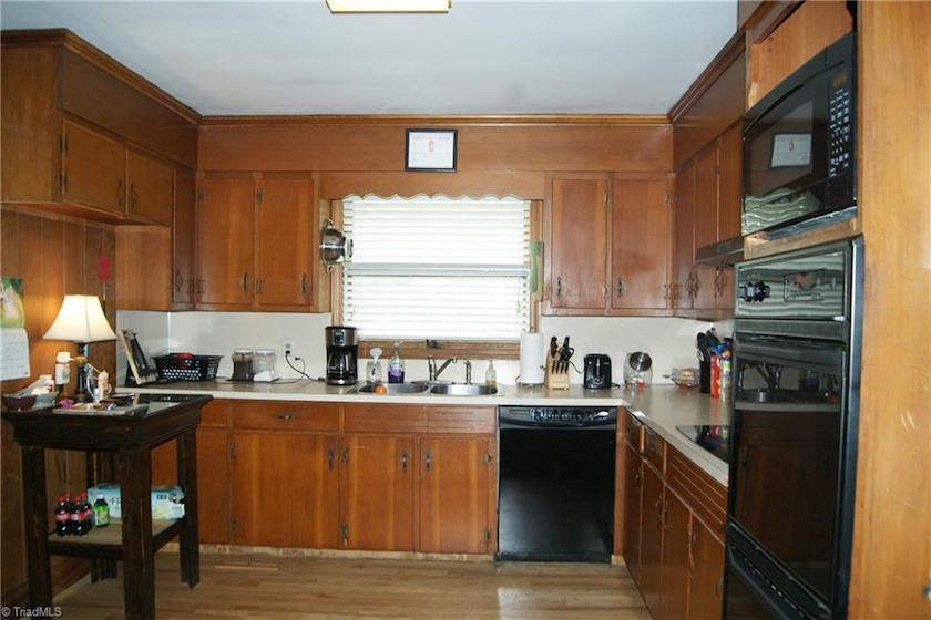 ranch house North Carolina - brown dated kitchen