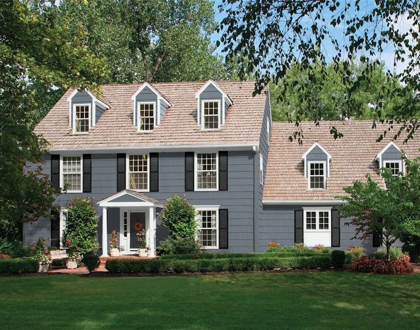 grey siding house with red brick