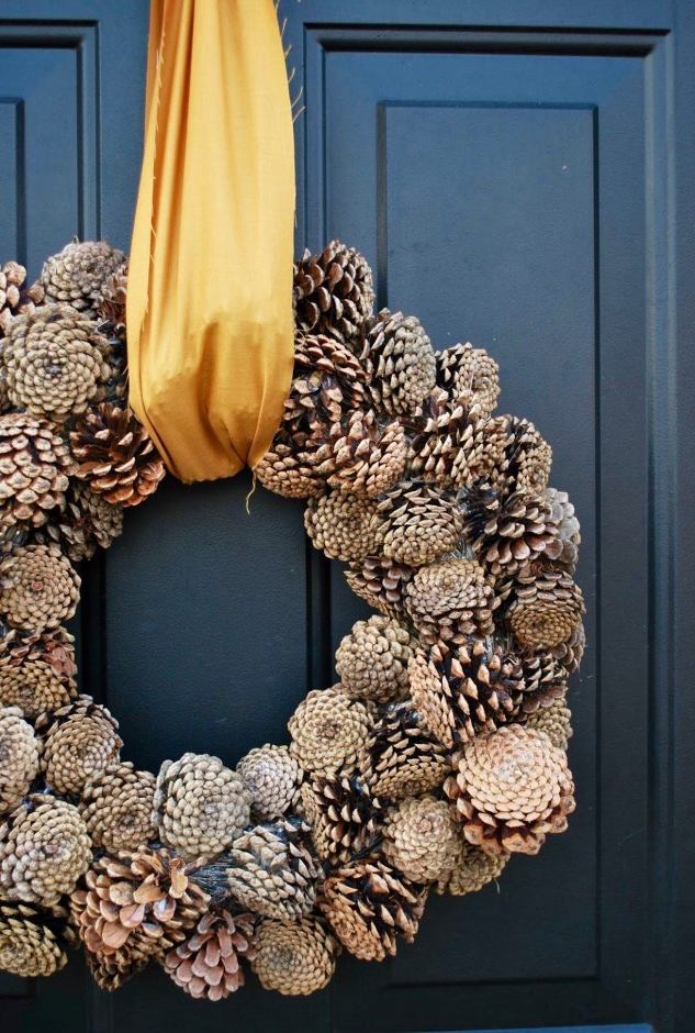 Pinecone wreath on blue door via Larissa Another Day blog