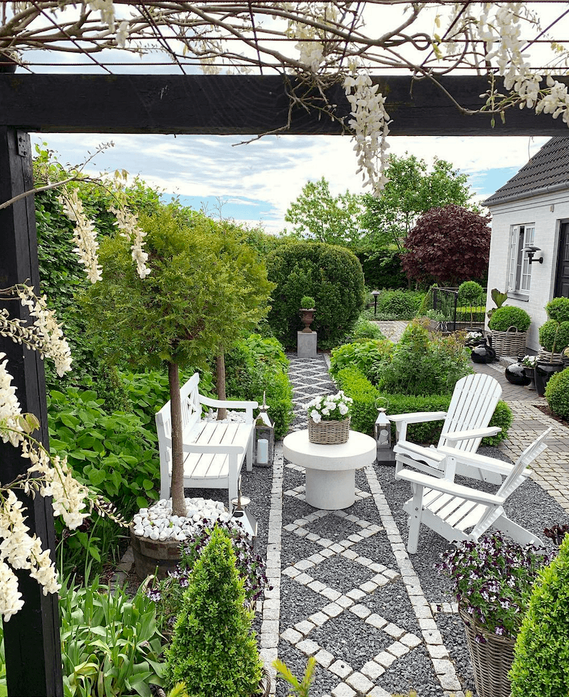 @gncgarden on instagram - gorgeous - garden - outdoor living - adirondack chairs - wisteria