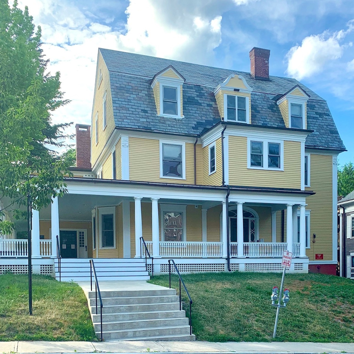yellow symmetrical late Victorian house, Northampton, MA Laurel Home