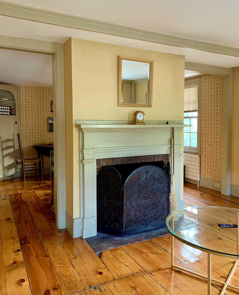 18th century mouldings and doors - 153 Elm St airbnb - fireplace wall runtel baseboard heat and radiators