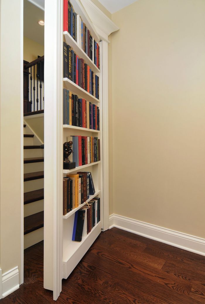 original sourc unknown - bookcase concealing staircase - hidden door - secret passage