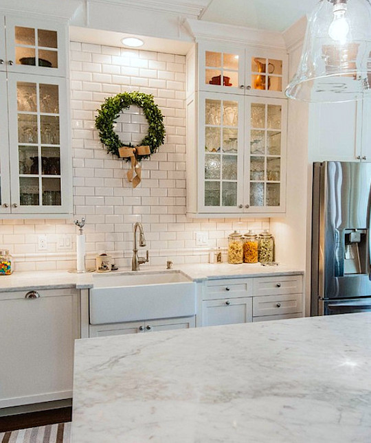 source unknown - white glass cabinets flanking sink - renovation ideas