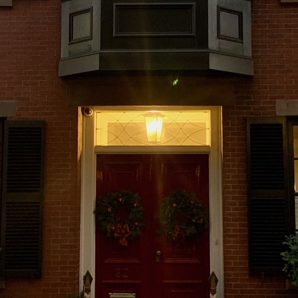 Beacon Hill home at night lovely red door and transom