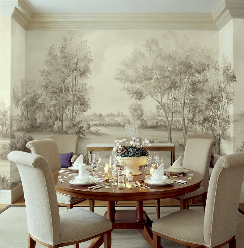 Beige upholstered chairs at circular table in cream townhouse dining room