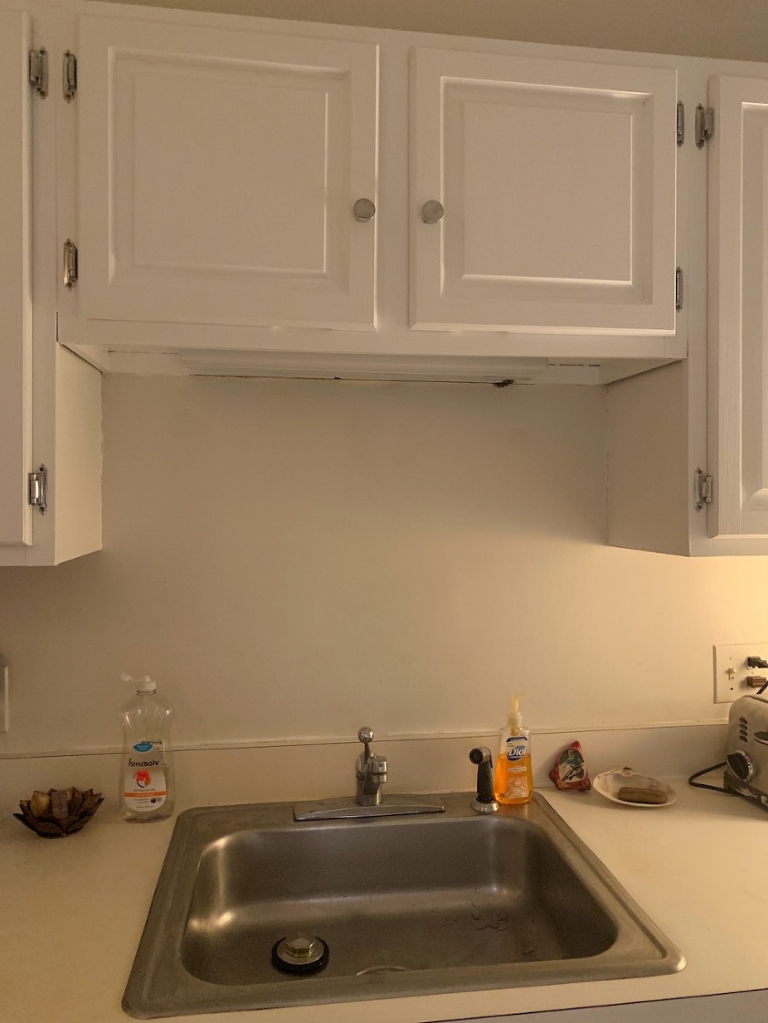number one lighting mistake-hideous light over sink