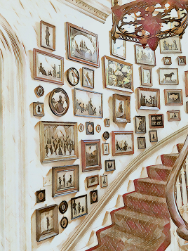 eclectic staircase gallery art wall curved stairs