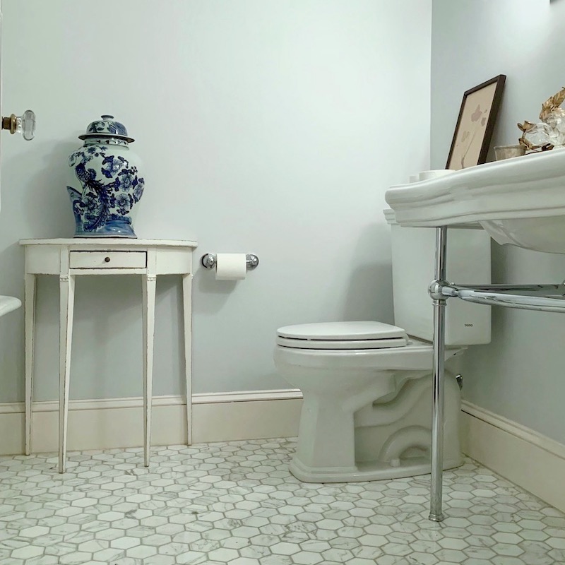 upstairs bathroom - paint color -- Benjamin Moore Marilyn's Dress 2123-60 - Chinoiserie ginger jar - Gustavian-style furnishings - demi-lune table from Chelsea Textiles