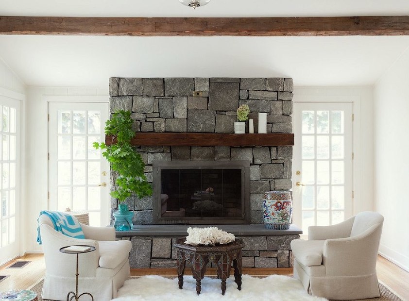 rustic-stone-fireplace-with-white-walls
